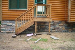 stone_on_cabin_for_jeff_and_Barb_Nadeau_right_side_of_steps_is_after_sealer-495x368